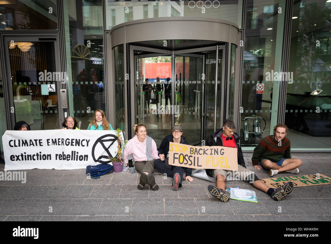 Manchester, UK. 02nd Sep, 2019. The Northern Rebellion which is part of the Extinction Rebellion movement occupied the doorway of the Barclays Bank office this morning by supergluing themselves to the floor. The protests started three days earlier in pursuit of peaceful action to create changes needed to overcome climate change. Credit: Andy Barton/Alamy Live News Stock Photo