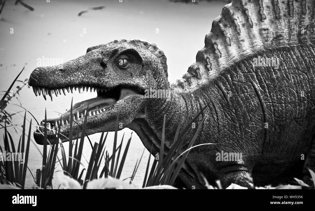 A Dinosaur in the Jurassic Journey trail at Birdland, Bourton-on-the-Water, Cotswold Stock Photo