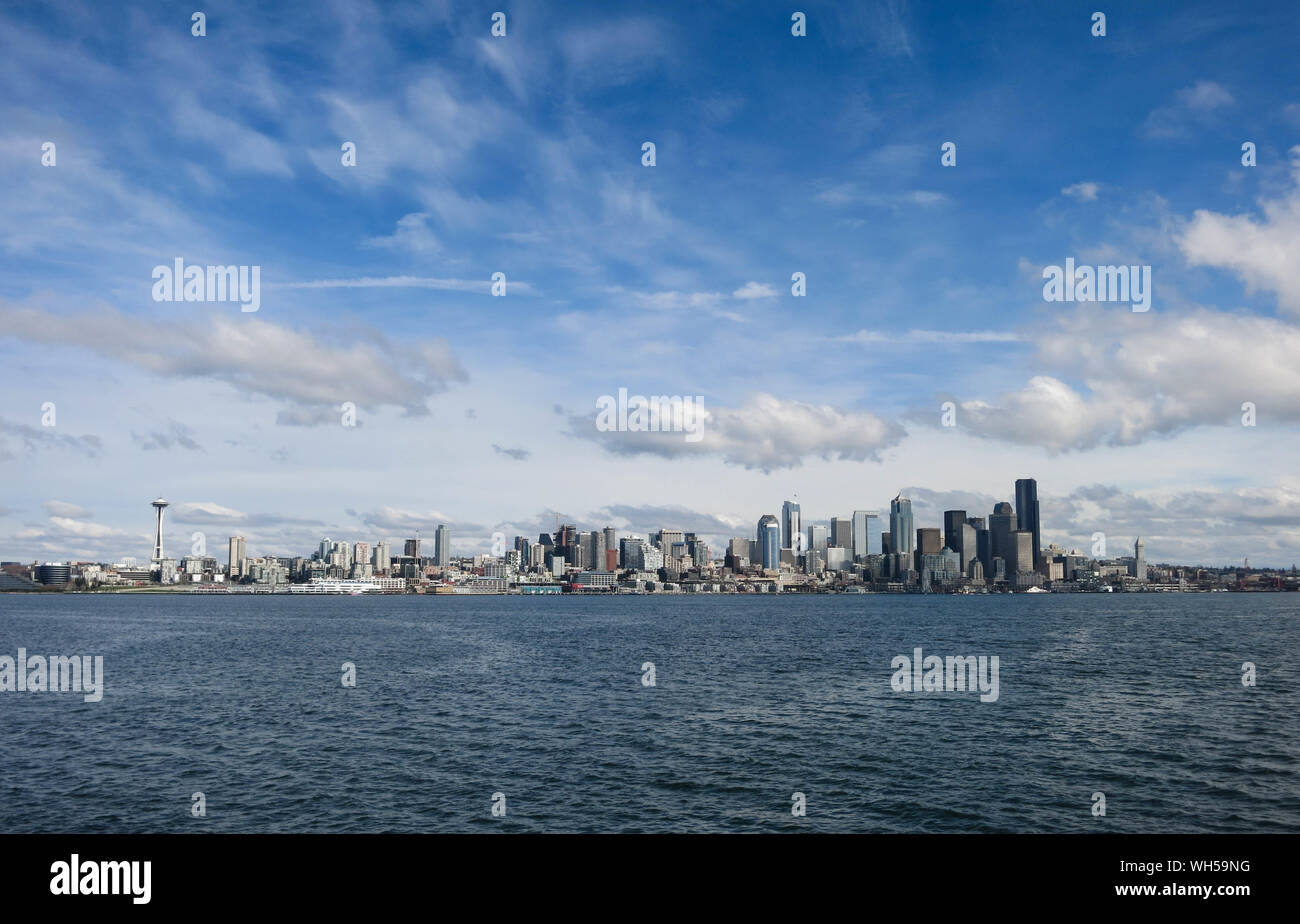 Seattle Cityscape Against Cloudy Sky Stock Photo