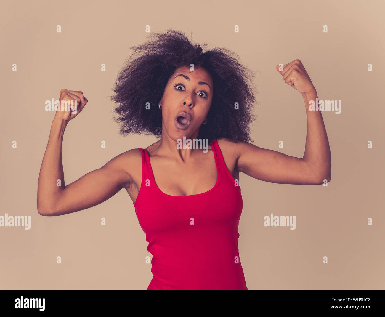 Portrait of young beautiful funny african american woman with afro hair