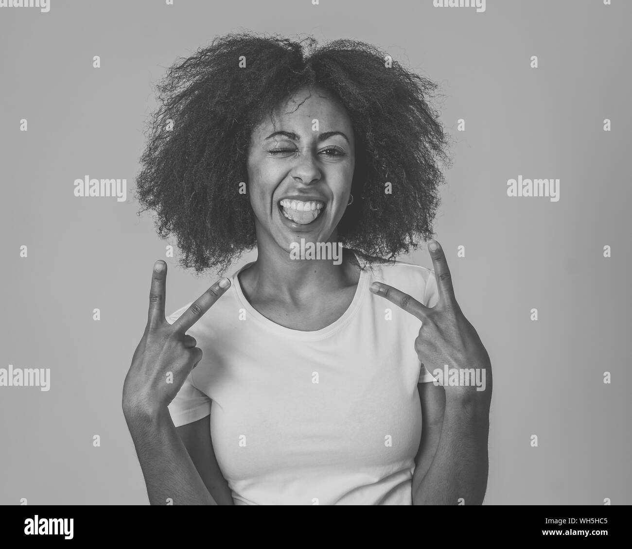 Portrait of attractive, confident african american young woman with happy facial expressions having fun posing. In People successful women and human e Stock Photo
