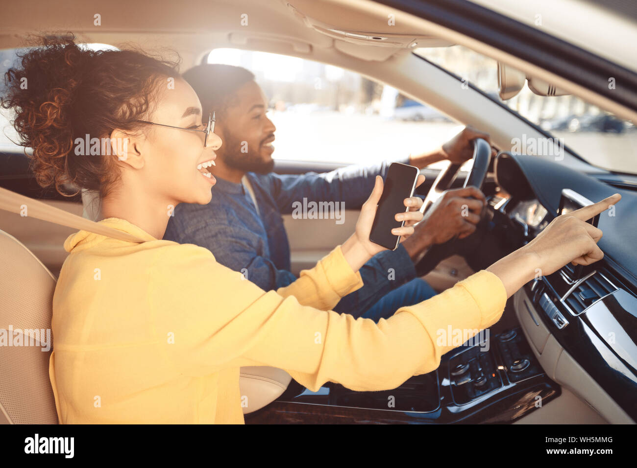 Road trip. Couple driving car and using gps navigator Stock Photo