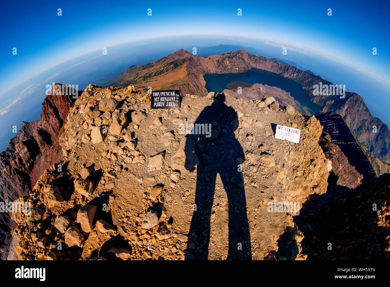 Fish-eye View Of Shadow On Mountain Against Sky Stock Photo