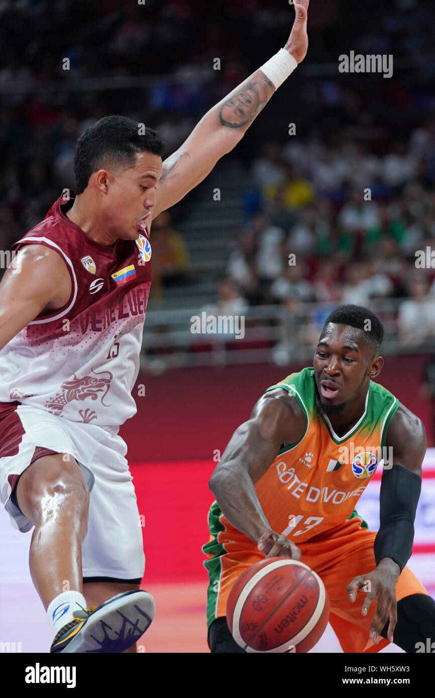 Beijing, China. 2nd Sep, 2019. Windi Graterol (L) of Venezuela defends Tiegbe Bamba of Cote d'Ivoire during the group A match between Venezuela and Cote d'Ivoire at the 2019 FIBA World Cup in Beijing, capital of China, on Sept. 2, 2019. Credit: Ju Huanzong/Xinhua/Alamy Live News Stock Photo