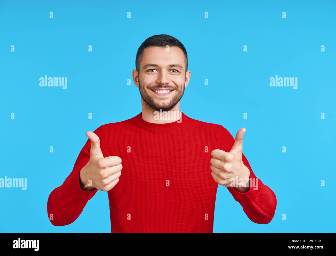 Handsome man showing thumbs up hi-res stock photography and images - Alamy