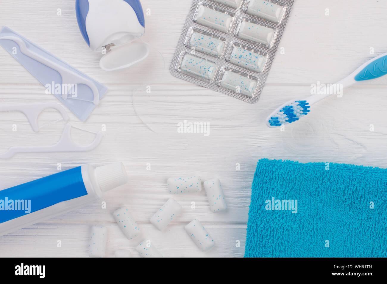 Toothpaste, toothbrush, dental floss and towel Stock Photo Alamy