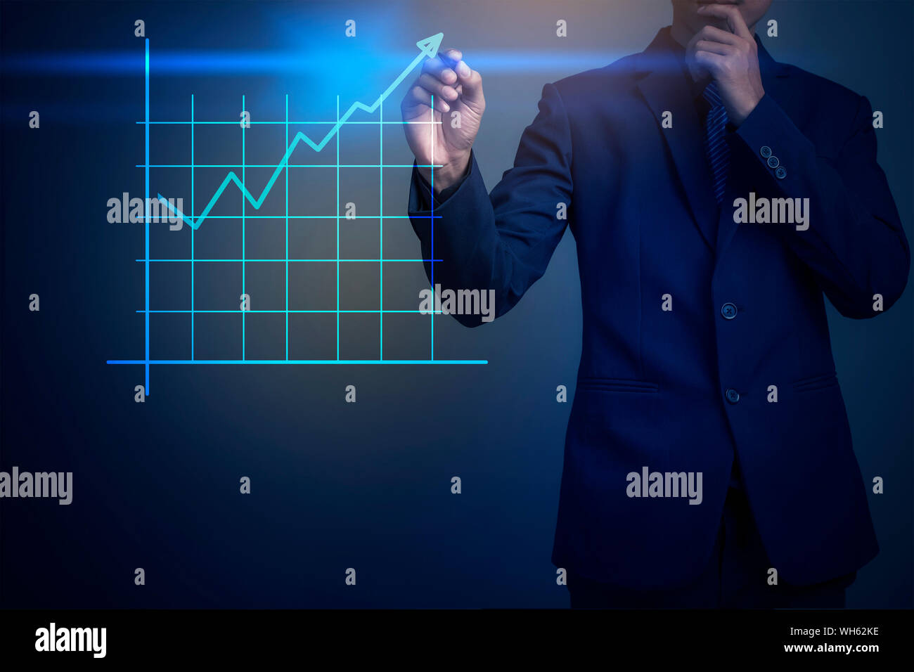 Midsection Of Businessman Analyzing Data Against Colored Background Stock Photo