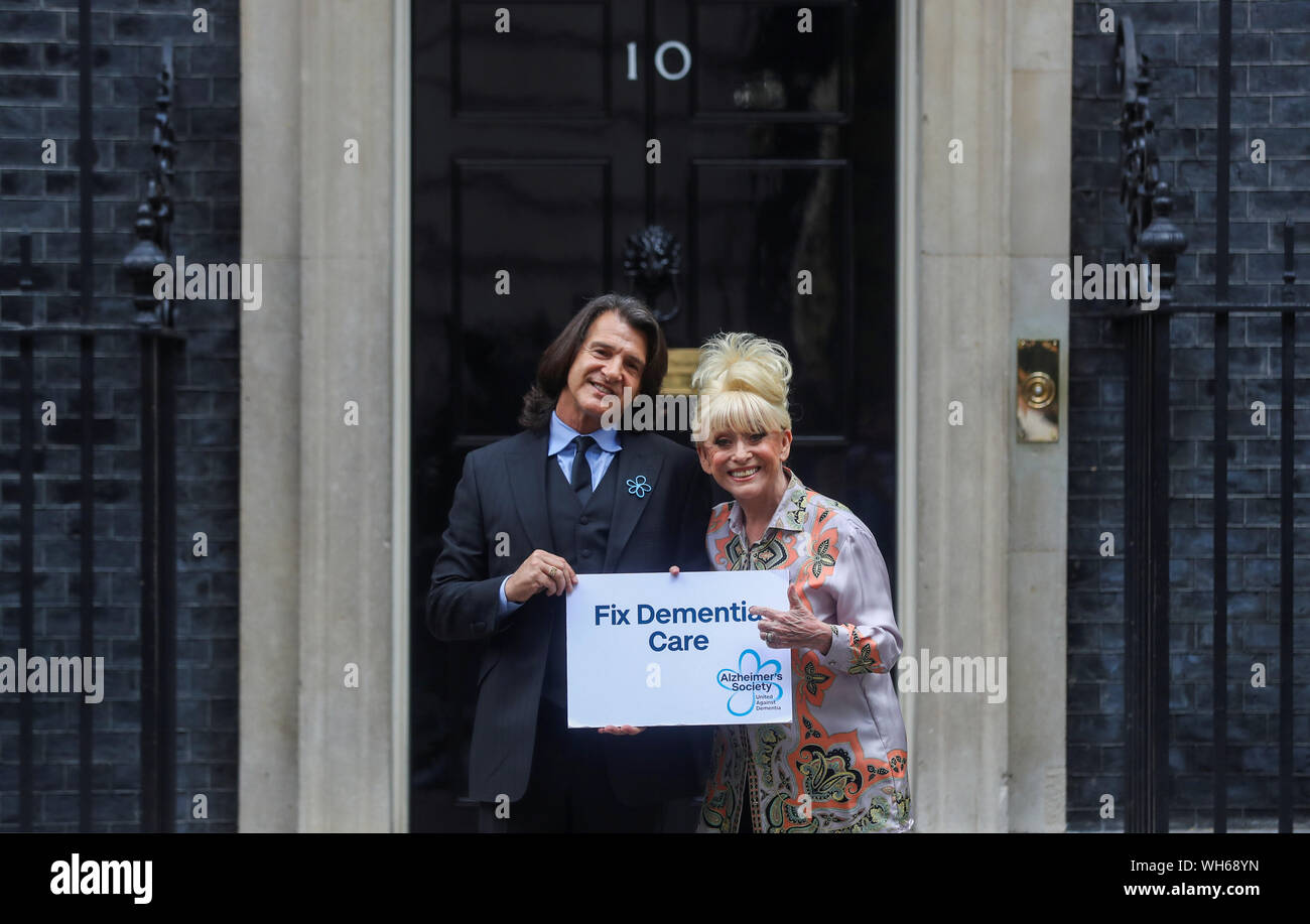 Dame Barbara Windsor and her husband Scott Mitchell deliver an Alzheimer's Society open letter to 10 Downing Street in Westminster, London, calling on Prime Minister Boris Johnson to address the 'devastating state' of dementia care. Stock Photo
