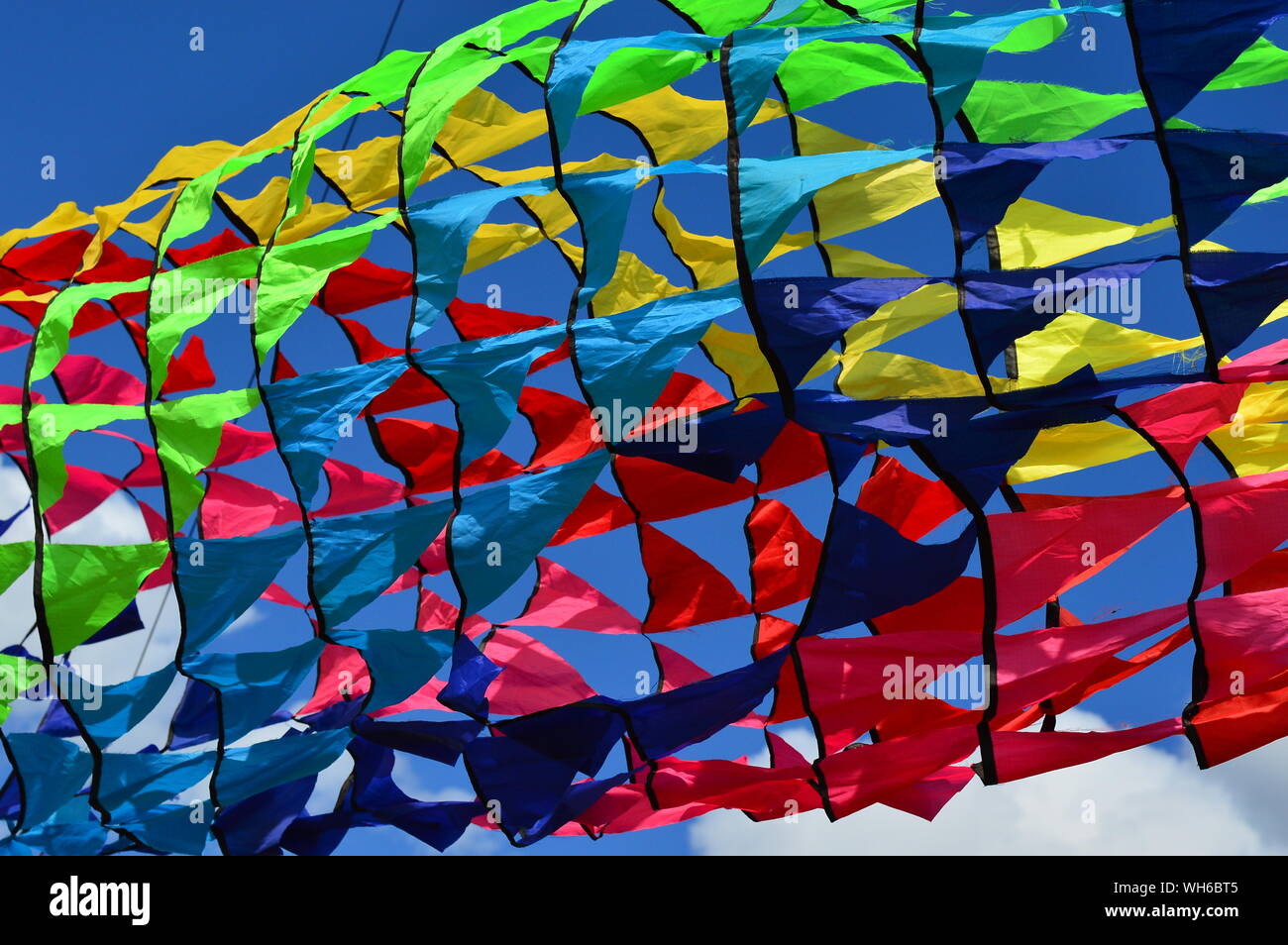 Colored ribbon kites. Round, long ribbons, on poles Stock Photo Alamy