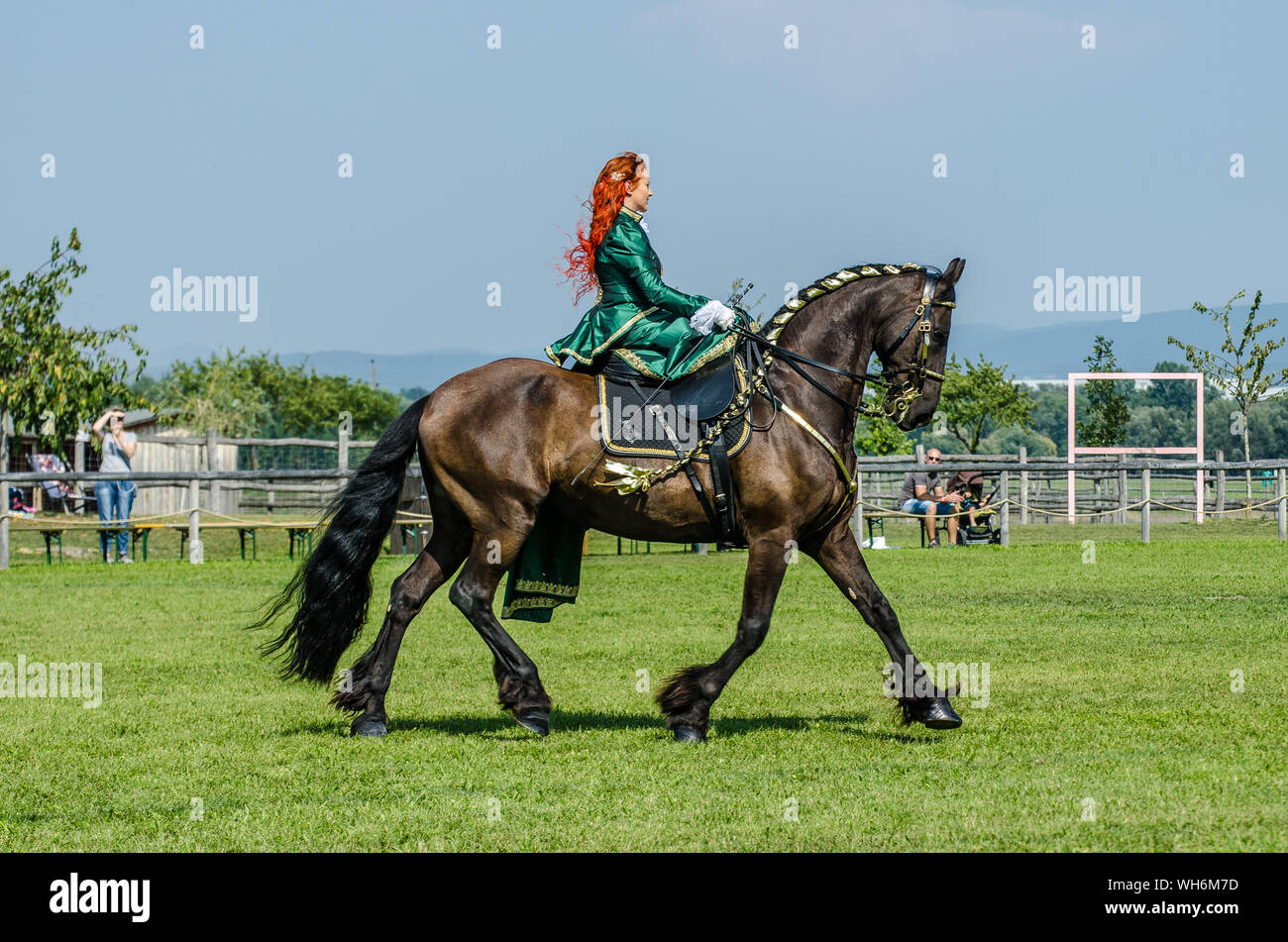 Schloss Hof Großes Pferdefest 2019 Great Equestrian Show at Schloss Hof Castle with two women riding on a side saddle Stock Photo