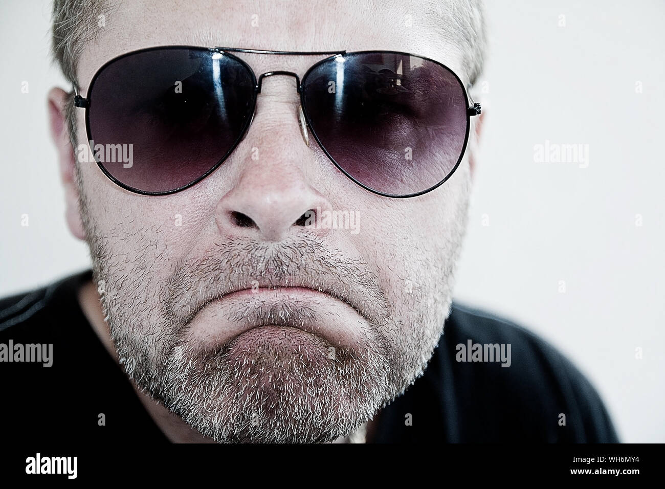 Close-up Of Man Frowning Stock Photo