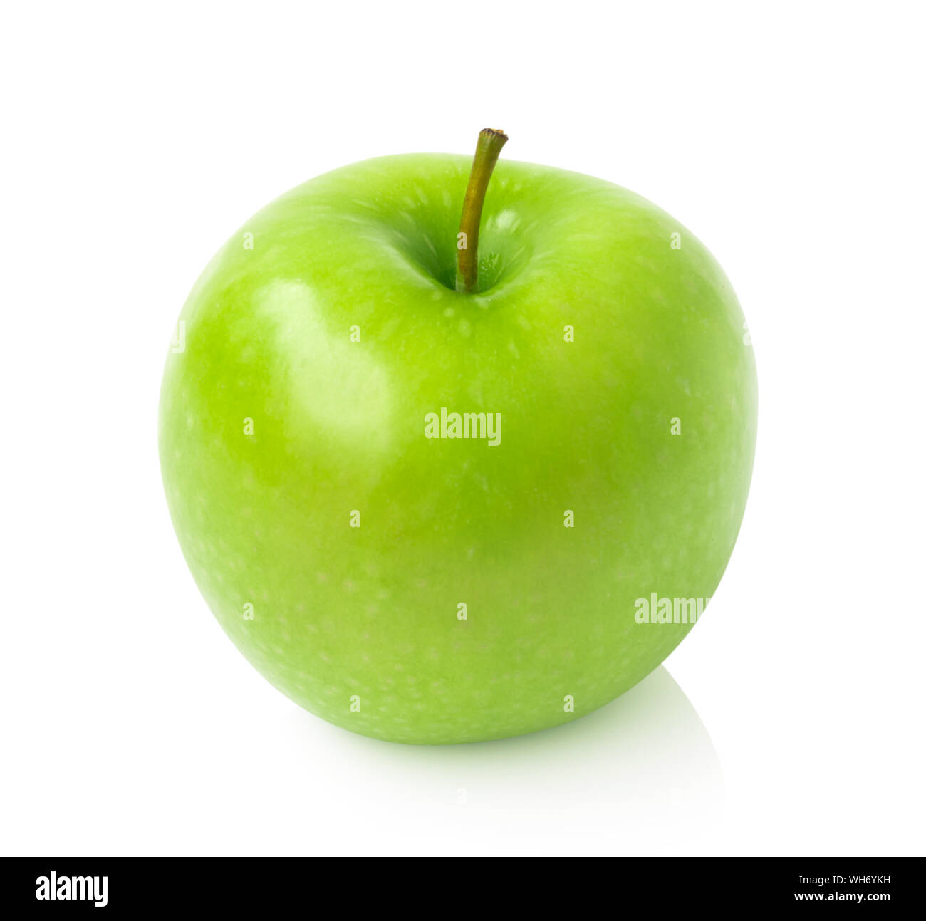 Close-up Of Granny Smith Apple Over White Background Stock Photo