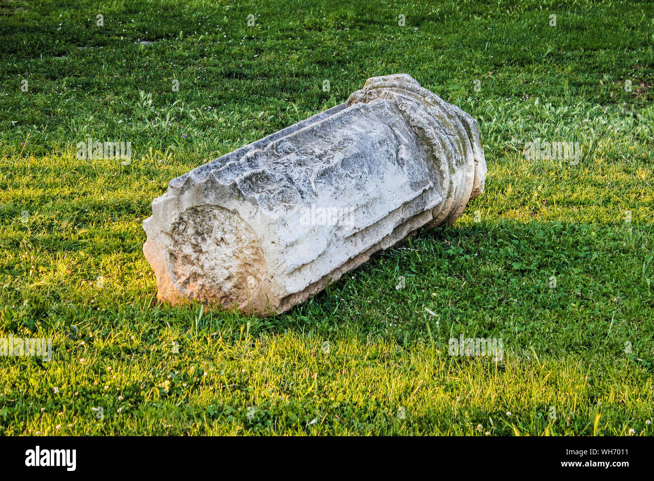 High Angle View Of Broken Column On Grassy Field Stock Photo