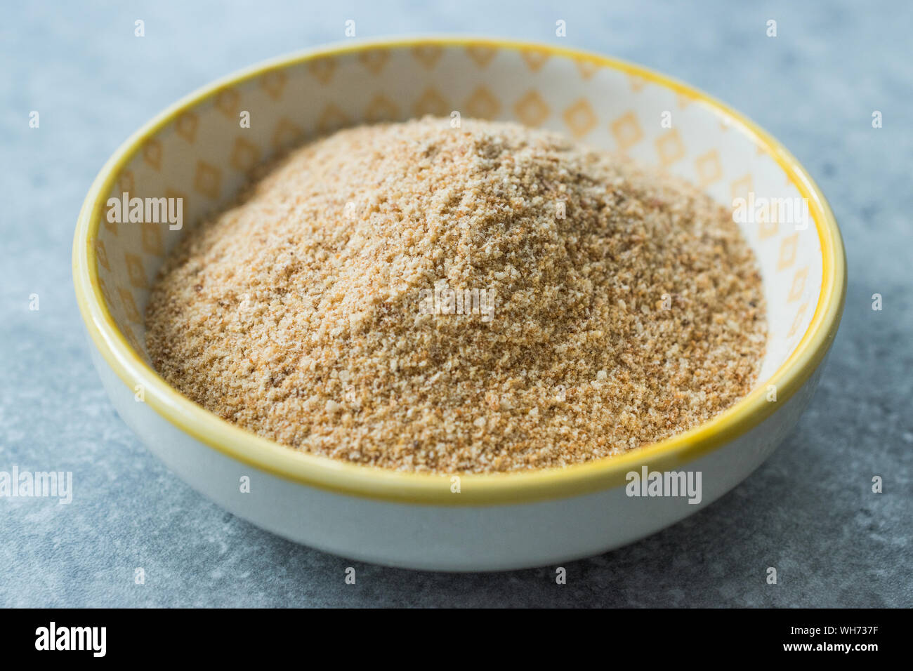 Bread Crumbs / Rusk Powder in Porcelain Bowl. Organic Food Stock Photo
