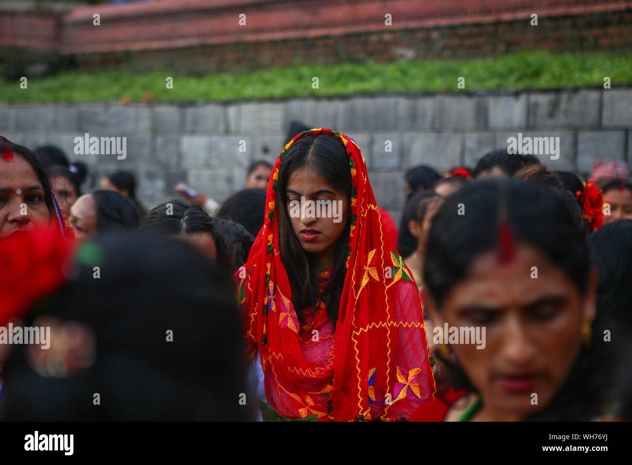 Kathmandu, Nepal. 02nd Sep, 2019. A Nepali Hindu woman offers prayers to Lord Shiva, the Hindu god of destruction during the festival.Teej Festival is a females-only festival celebrated by Hindu women. During the festival, women fast and pray for marriage and family. Single women pray for an auspicious future marriage, while married women pray for marital bliss. The festival is celebrated mainly in India, but Nepalese women also celebrate Teej in their own special way. Credit: SOPA Images Limited/Alamy Live News Stock Photo