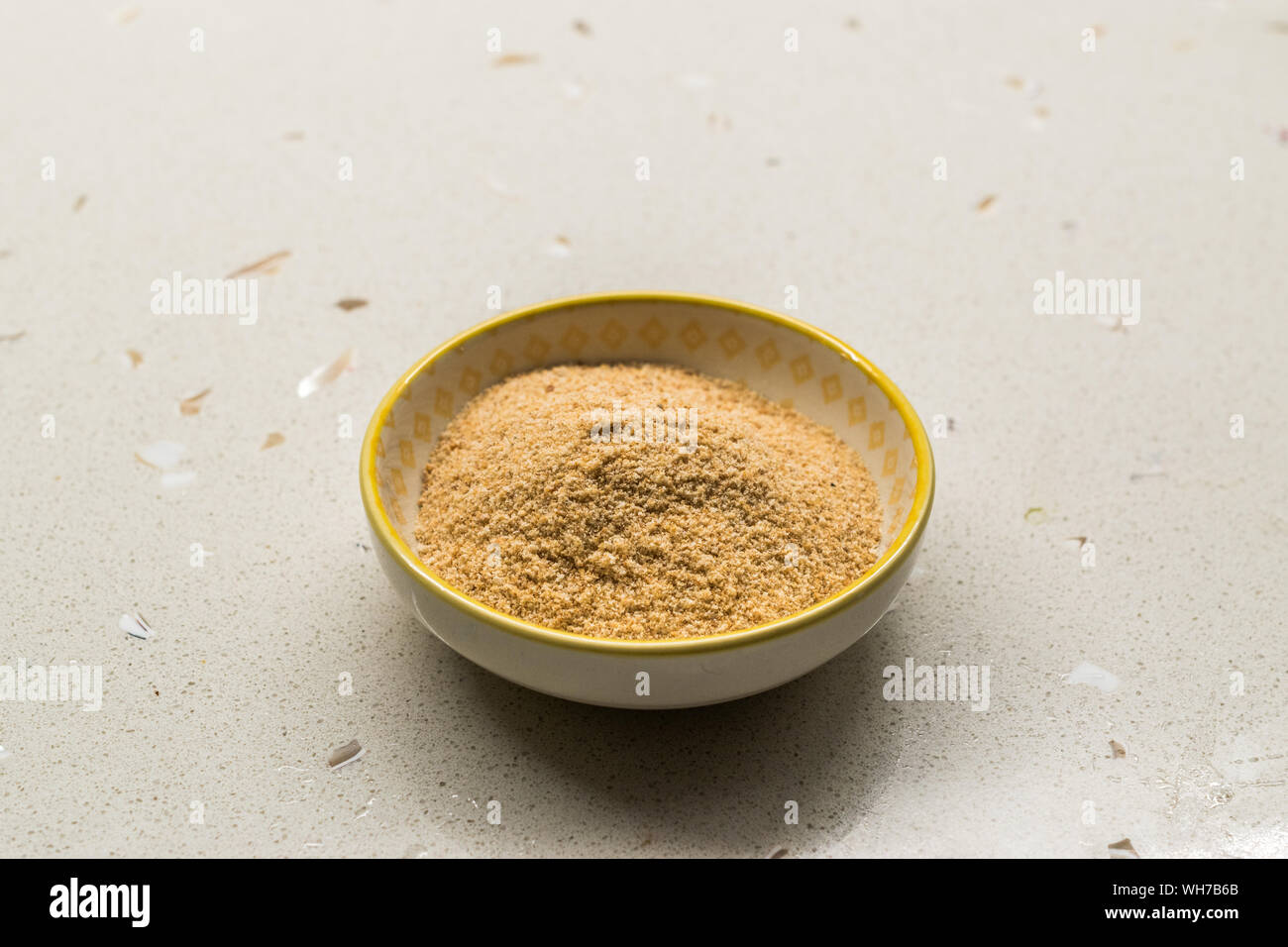 Bread Crumbs / Rusk Powder in Porcelain Bowl. Organic Food Stock Photo