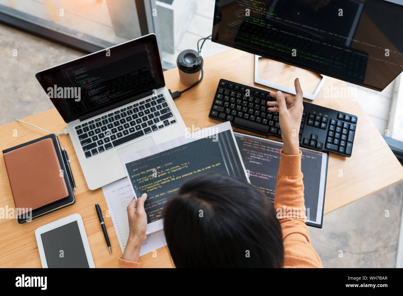 Asian team Outsource Developer Looking Screen Programming Code Working with Laptop Computer Software Stock Photo