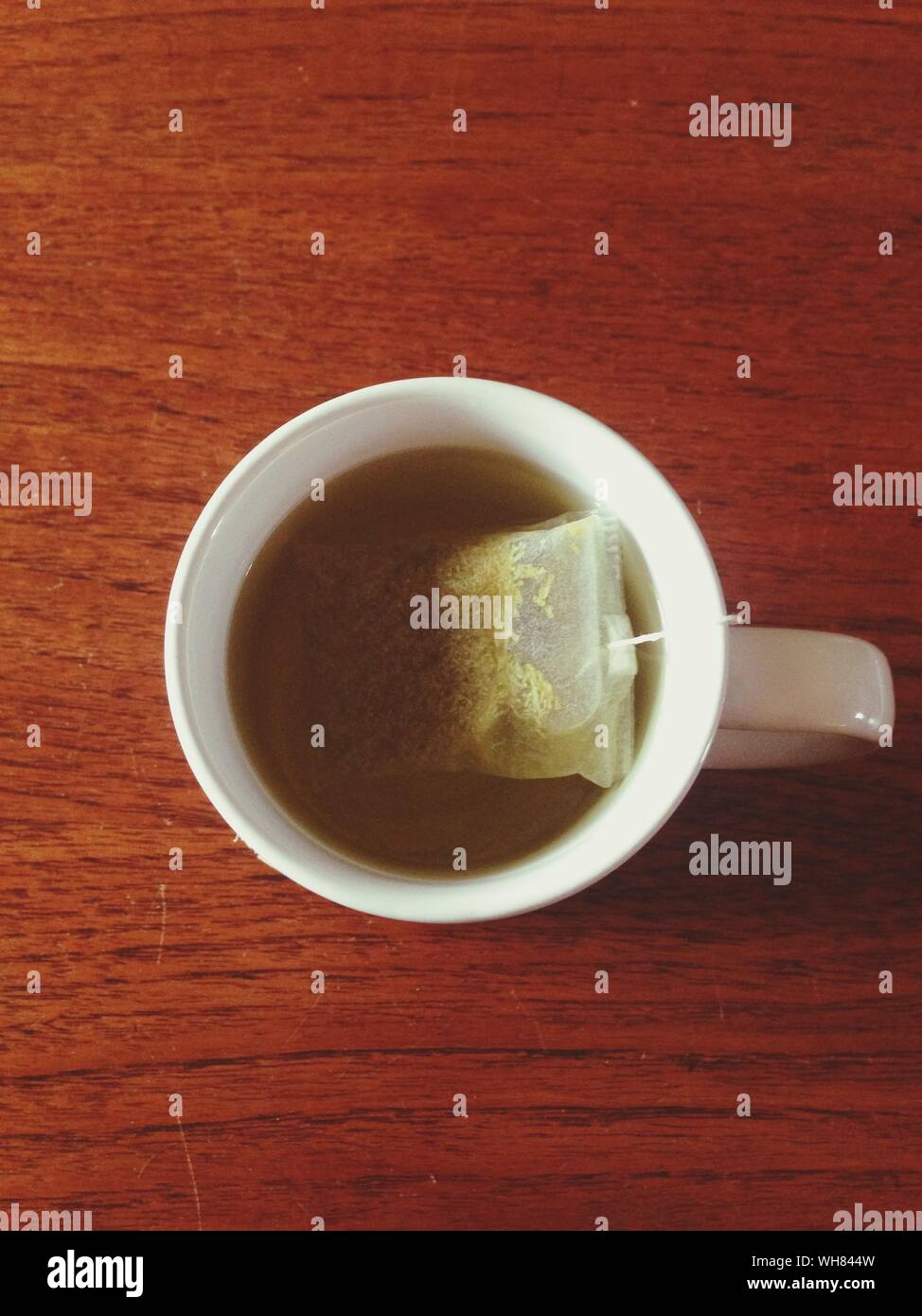 Directly Above Shot Of Green Tea In Tea Bag On Table Stock Photo