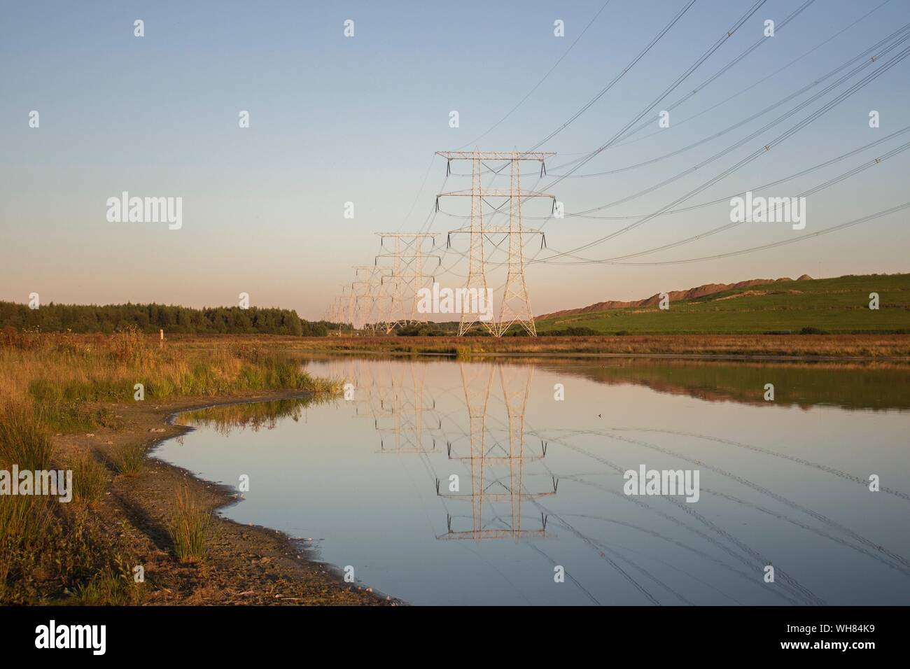Electricity pylons in water hires stock photography and images Alamy
