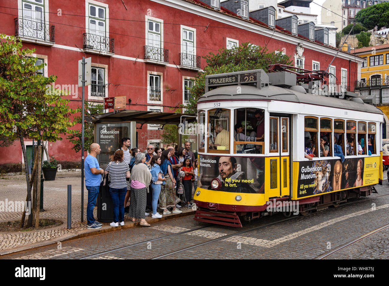 Lisbon, Portugal - July 27, 2019: Trams providing mass public transportation in the Alfama district of Lisbon, Portugal Stock Photo