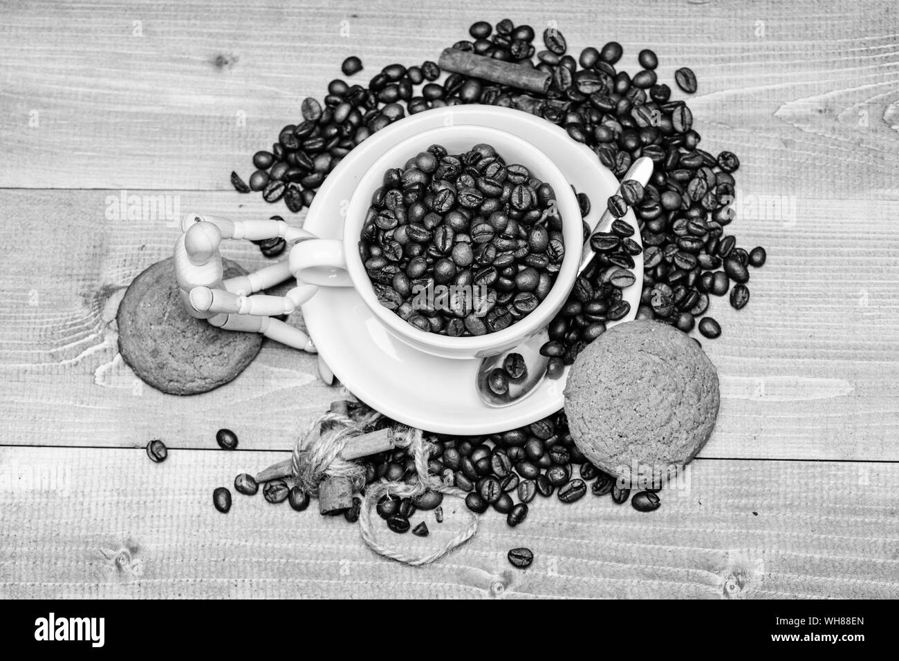 Inspiration and energy charge. Cup full coffee brown roasted bean blue