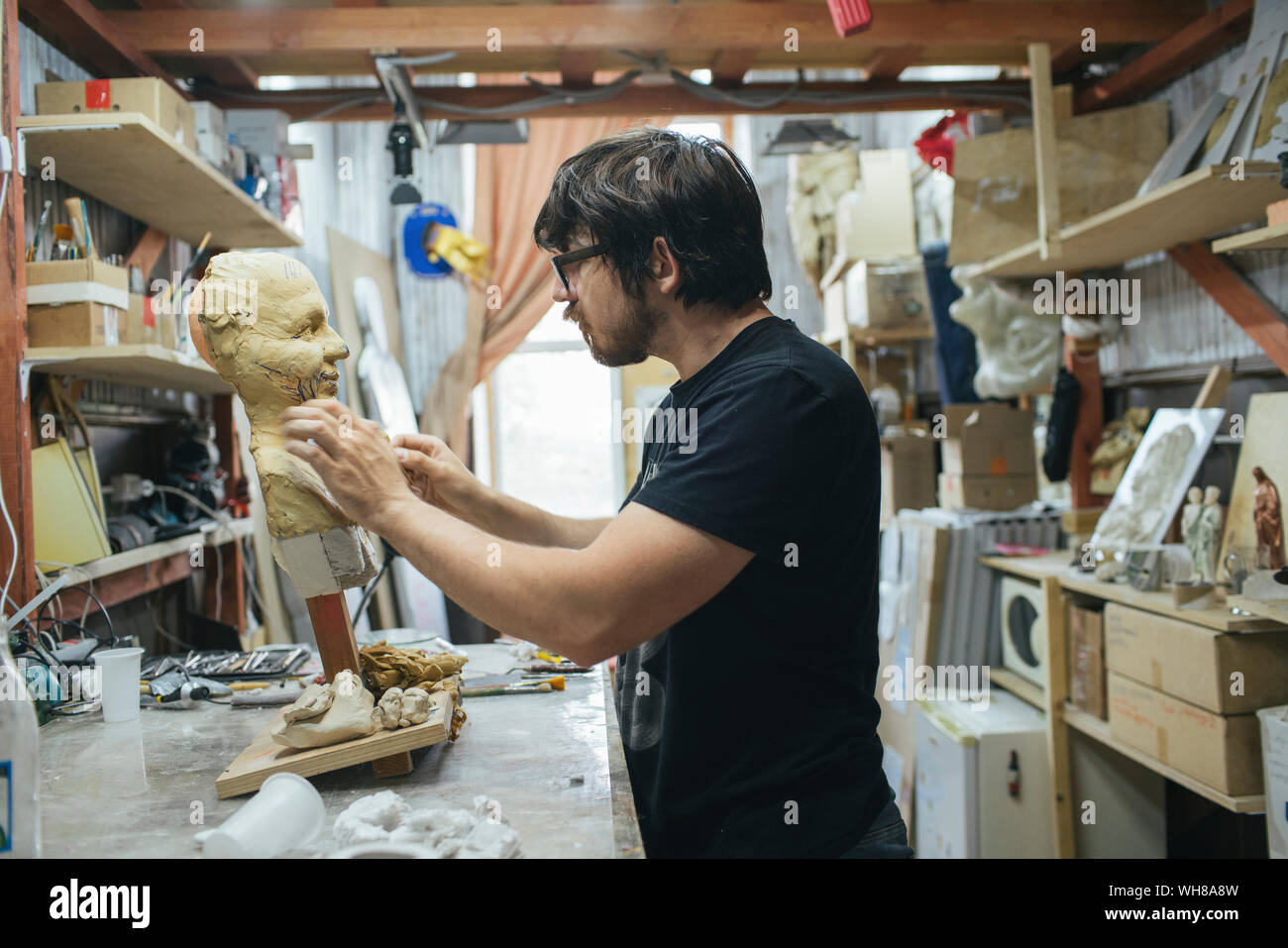 Sculptor working on a bust Stock Photo Alamy