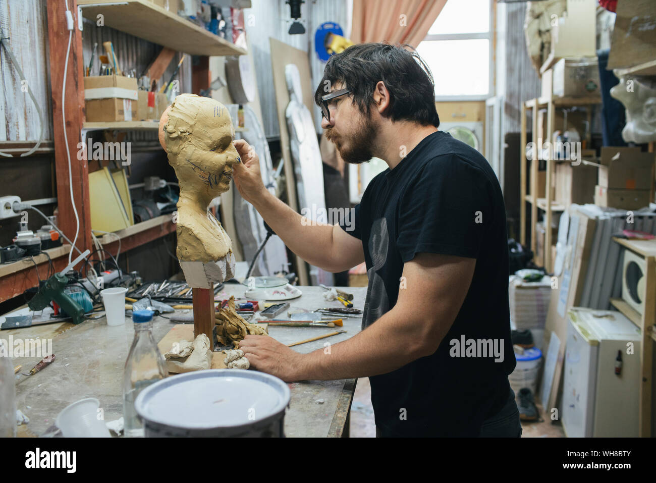 Sculptor working on a bust Stock Photo - Alamy