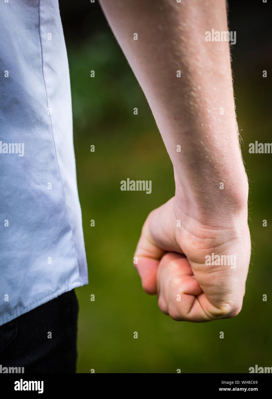 Close up of a school boy making a fist ready for a fight Stock Photo