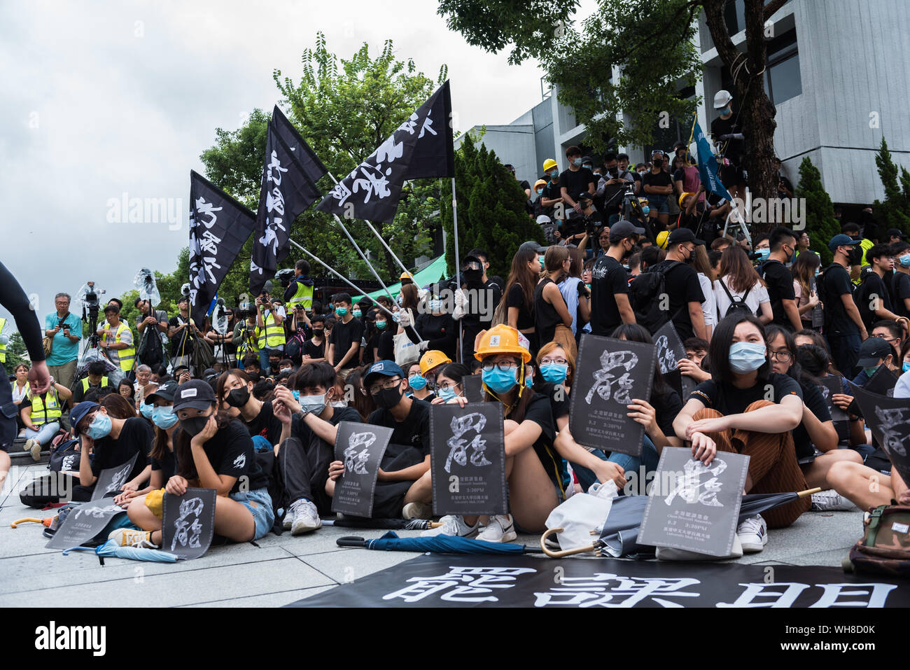 Students hold placards during the rally.Thousands of students gathered in masses to boycott the beginning of the academic semester in support of the anti-extradition movement. Various speakers and community leaders gave encouraging speeches regarding the movement. Stock Photo