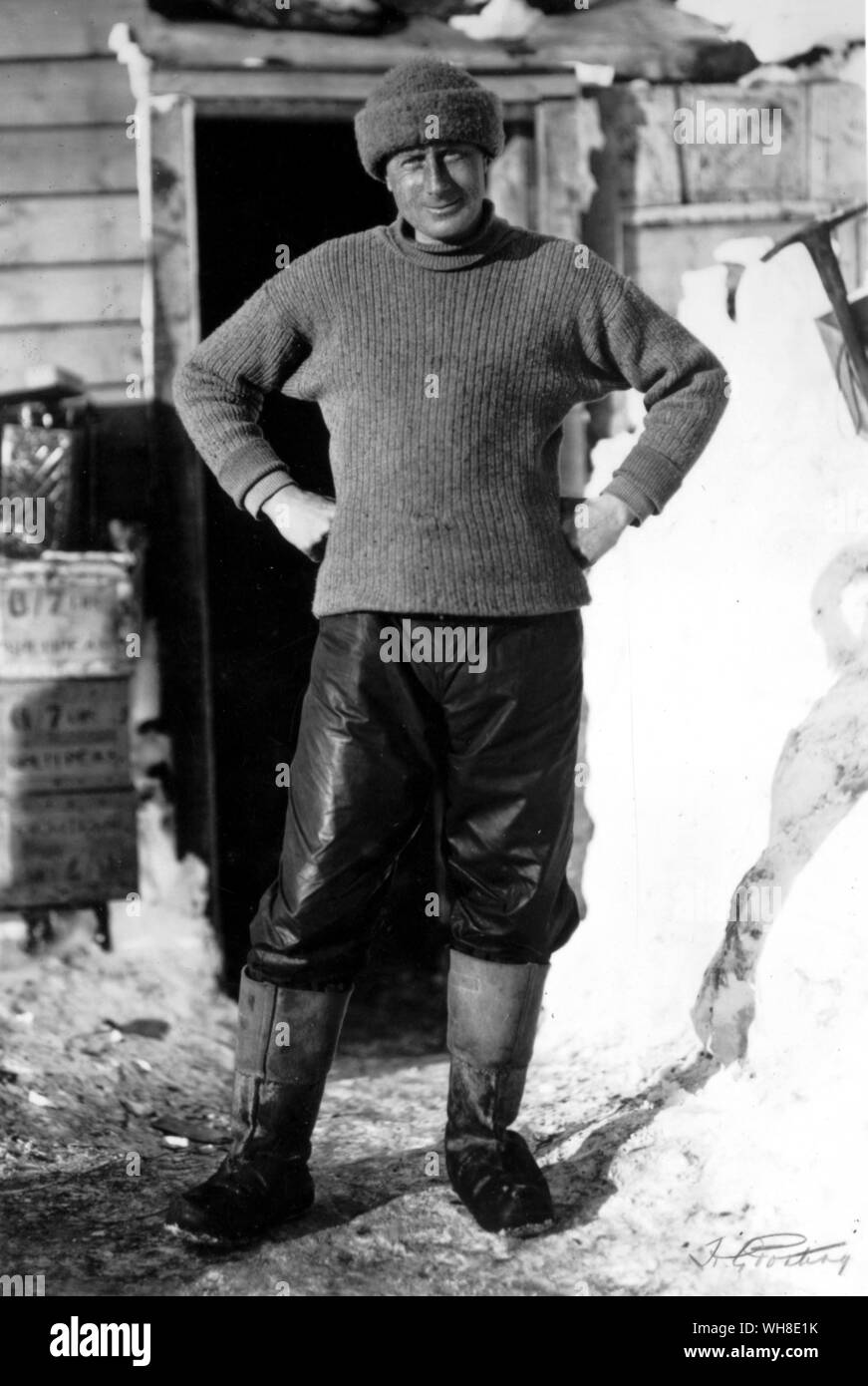 Full length portrait of Dr Wilson standing at the door of hut October 1911. In 1910 Wilson set sail on the Terra Nova, under Scott, as Chief of the Scientific Staff. From Antarctica: The Last Continent by Ian Cameron page 33. Stock Photo