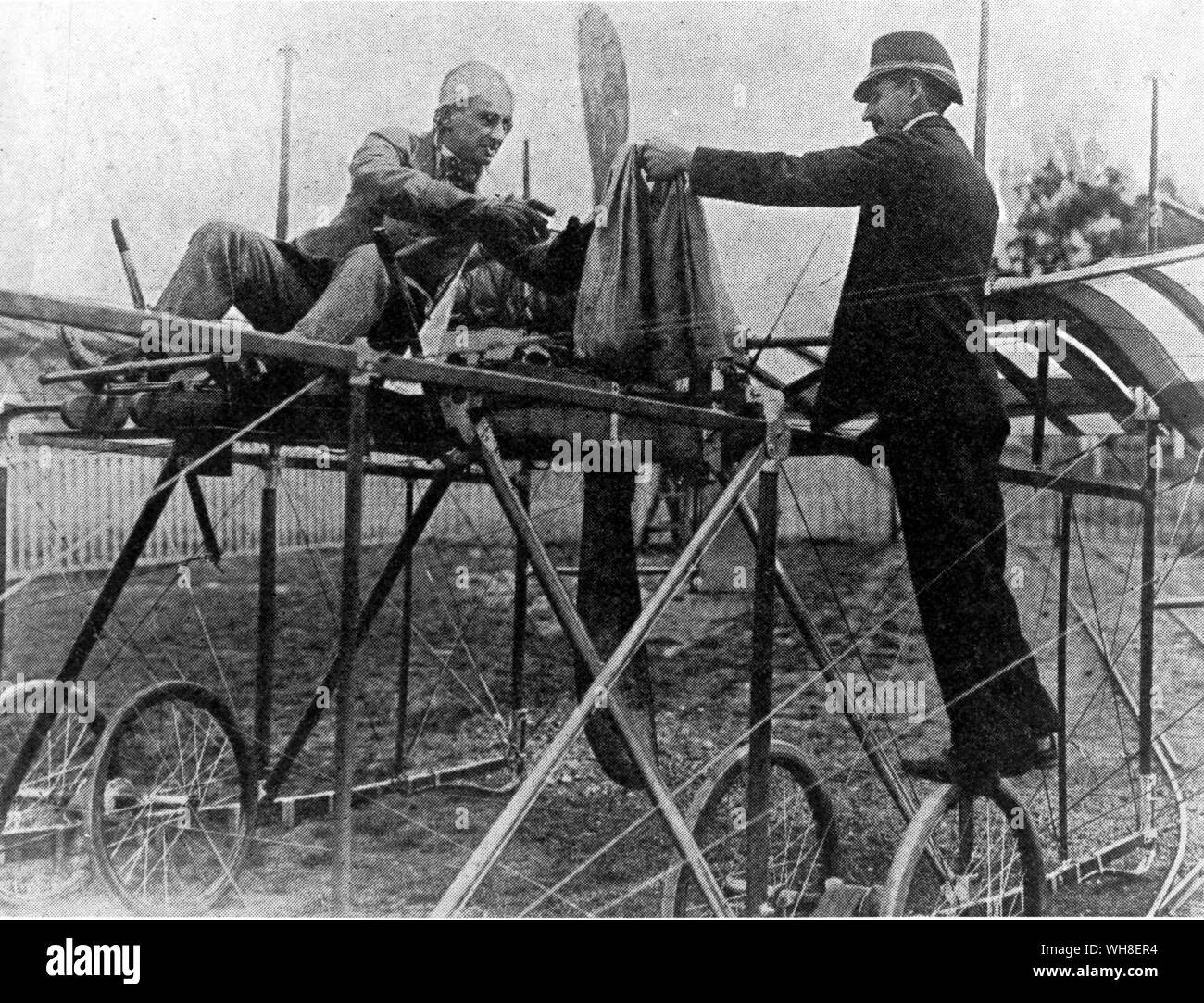 First UK Aerial Post. Postman handing bag to airman. The first mail to be carried by an air vehicle was on 7 January 1785, on a balloon flight from Dover to France near Calais. Stock Photo