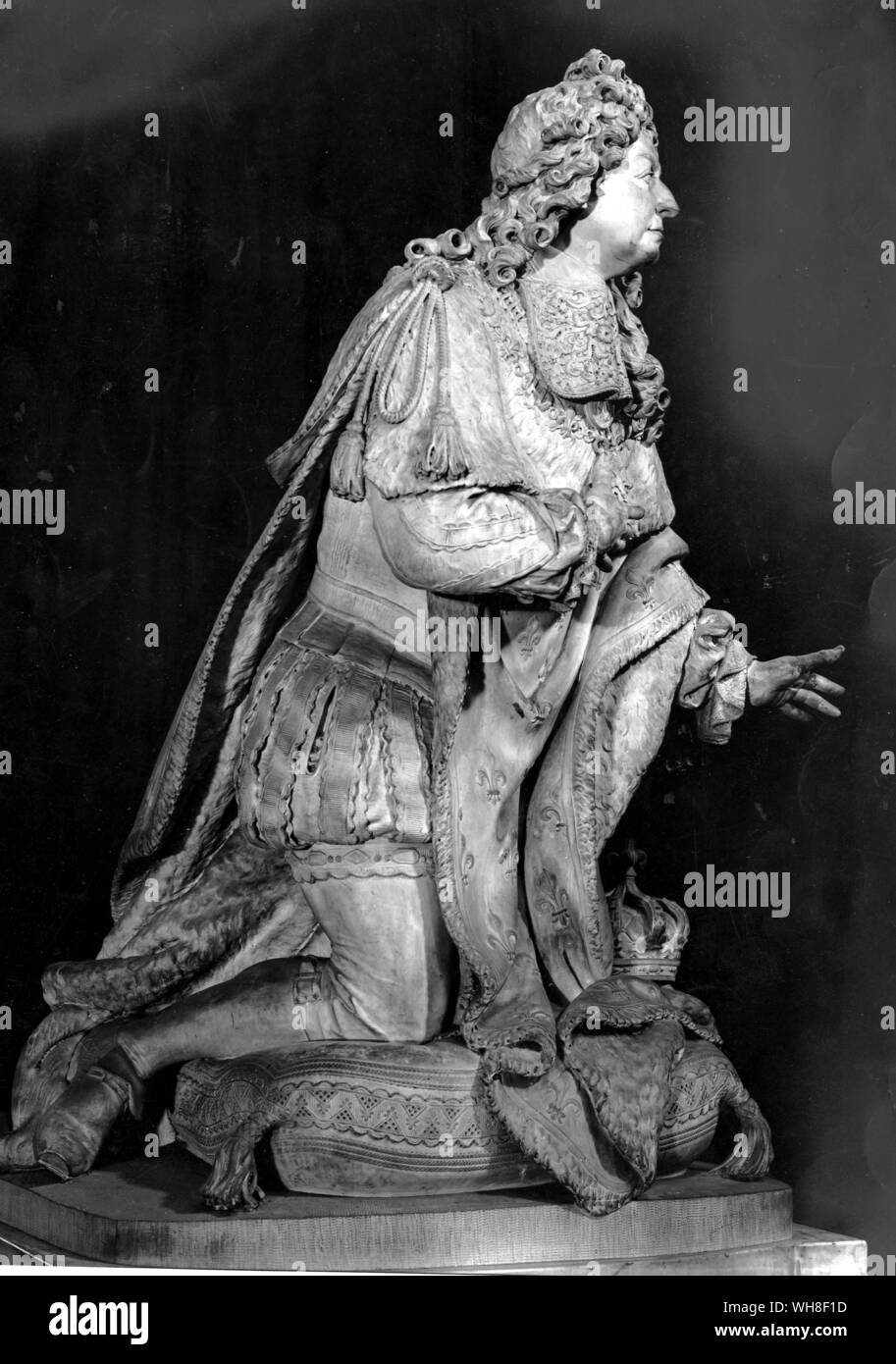 Louis XIV King of France, the Sun King, (1638-1715), reigned 1643-1715. Shown praying by Antoine Coysevox, (1640-1720), French Baroque Era Sculptor, 1715. The Sun King by Nancy Mitford, page 172. Stock Photo