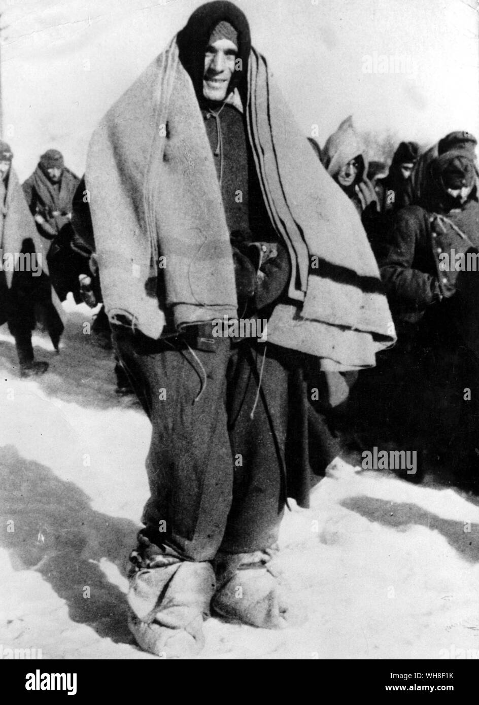 A captured German soldier muffled up in blankets in an endeavour to keep warm in the bitter Russian winter. World War II, 1939-1945. Stock Photo