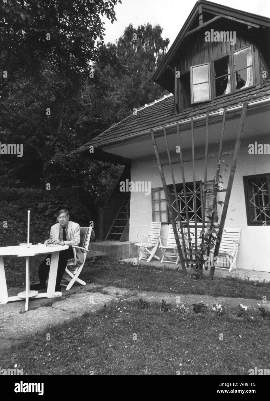 WH Auden (1907-1973) at home. The farmhouse Kirchstetten near Vienna which Auden and Kallman bought in 1958 and remained their summer house until Auden's death in 1973. . . Stock Photo