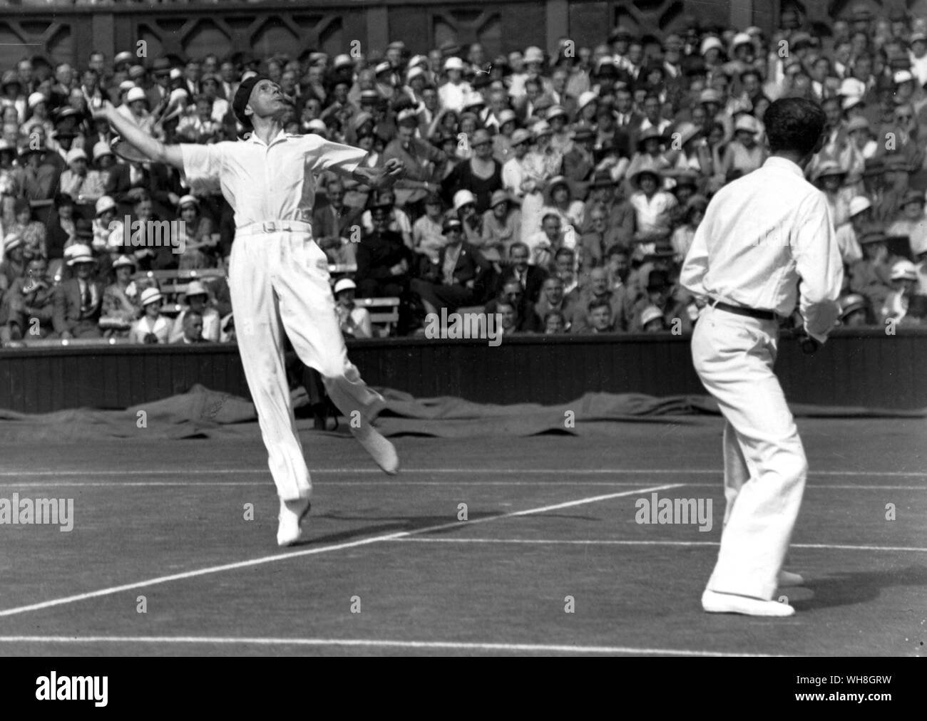 Jean Borotra the Bounding Basque and Henri Cochet in mens doubles at Wimbledon. The Encyclopedia of Tennis page 34. Stock Photo