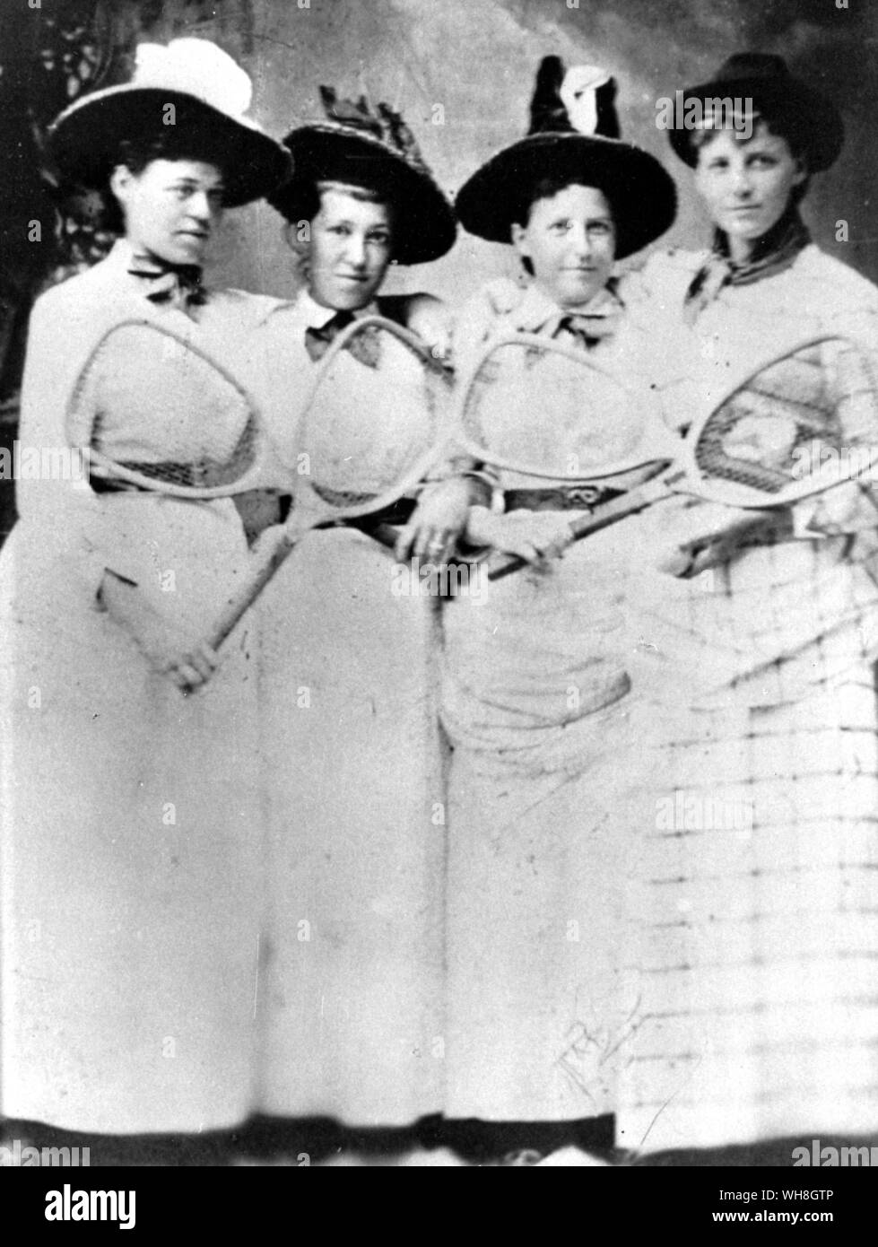 Ellen Hansell (right) with three early American tennis players: (left to right) Bertha Townsend (champion 1888-9), Margie Ballard and Louise Allerdice. The Encyclopedia of Tennis page 258. Stock Photo