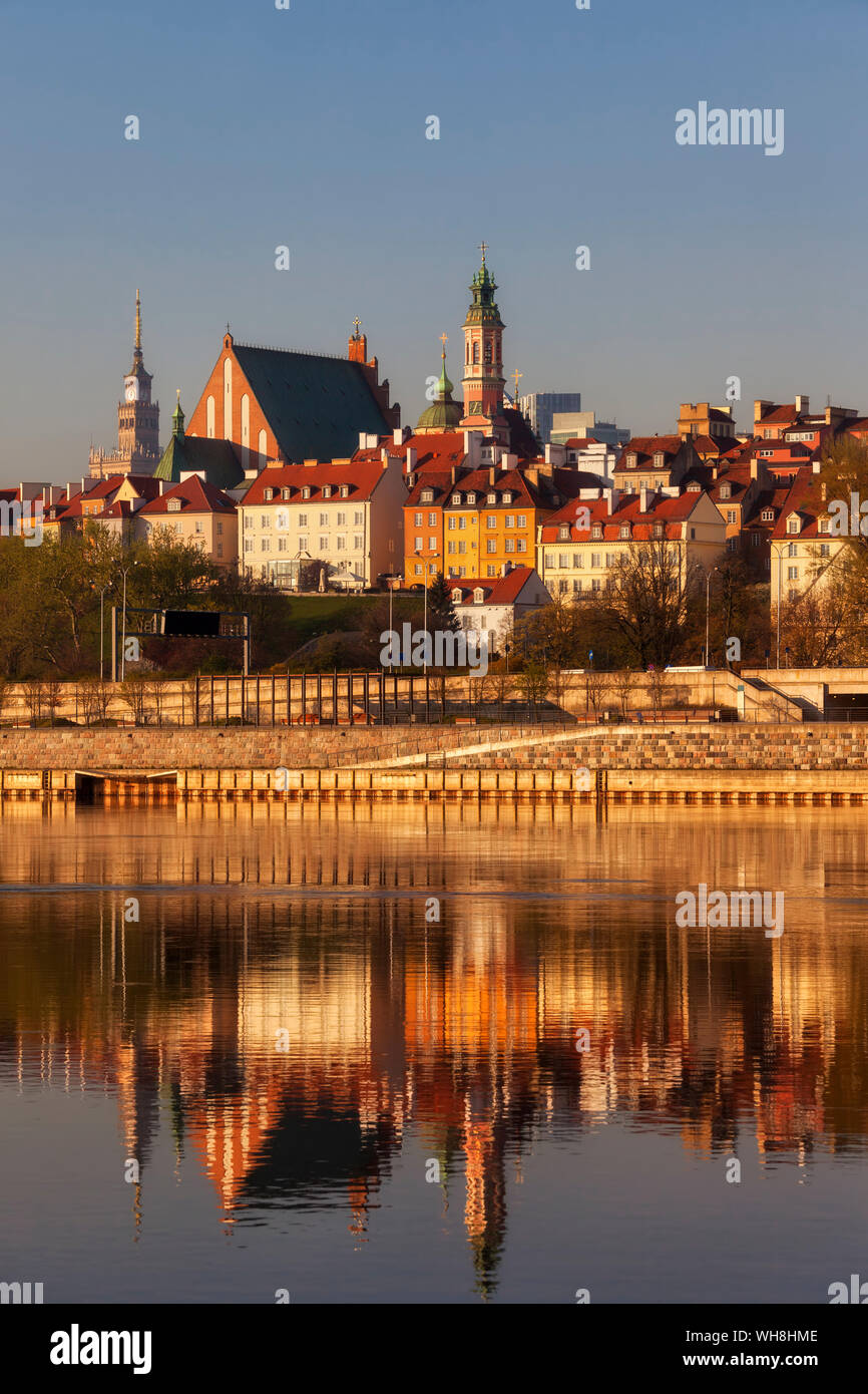 City skyline at sunrise, view across the Vistula River to the Old Town, Warsaw, Poland Stock Photo