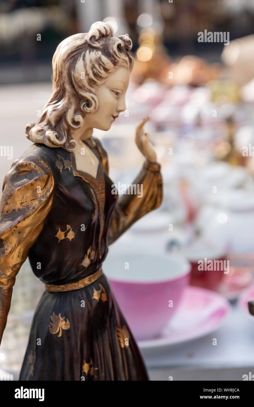 Statue of young fashion woman on flea market Stock Photo Alamy