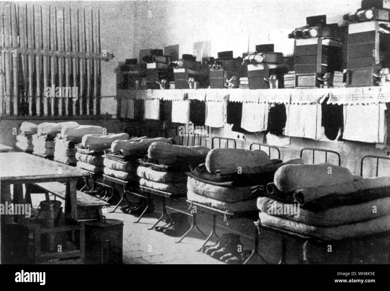 The cramped conditions and lack of privacy of a Legion dormitory at Sidi bel Abbes requirred every legionnaire to conform to the system even to placing his boots at a precise spot under his bed Stock Photo