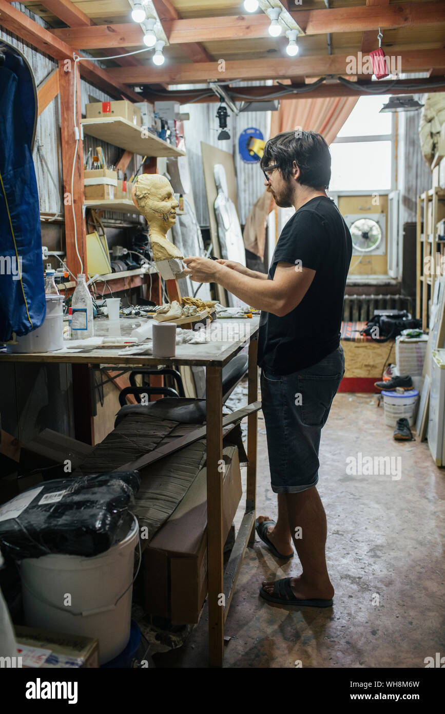 Sculptor working on a bust Stock Photo Alamy