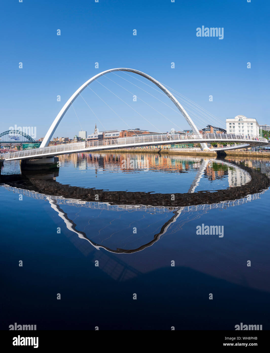Under a blue sky Newcastle upon Tyne and Millennium Bridge viewed from Gateshead side of river Tyne Stock Photo