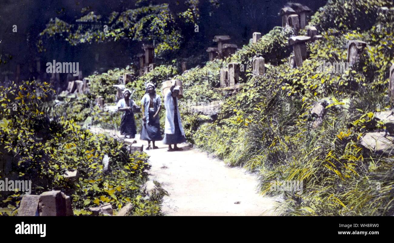 Women on the road through the cemetery on Toshi island. 1904. Stock Photo