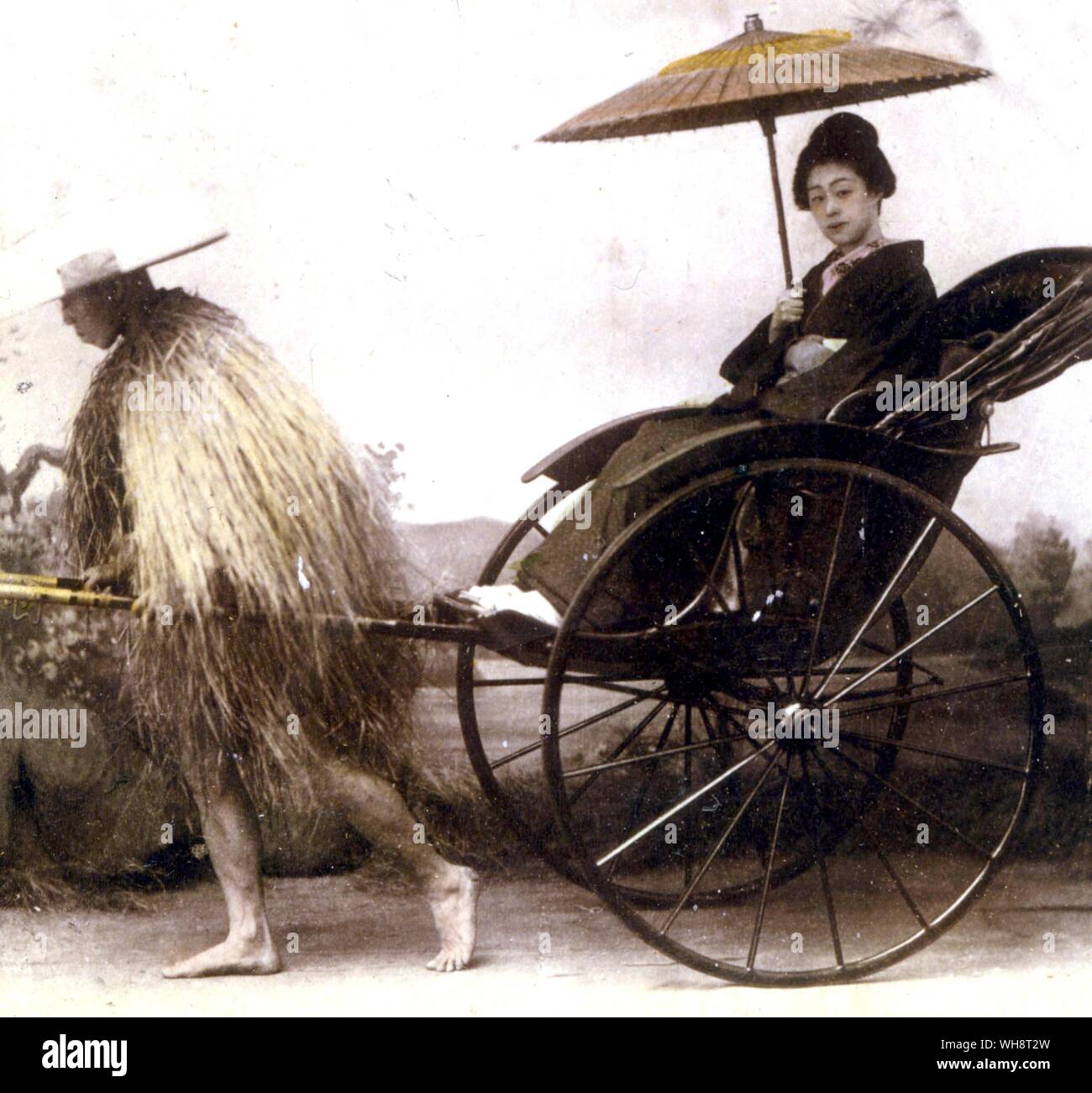 A geisha travelling in a rickshaw. Tokyo, 1899. Stock Photo