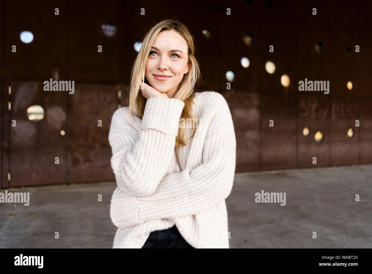 Portrait of smiling young woman outdoors Stock Photo - Alamy