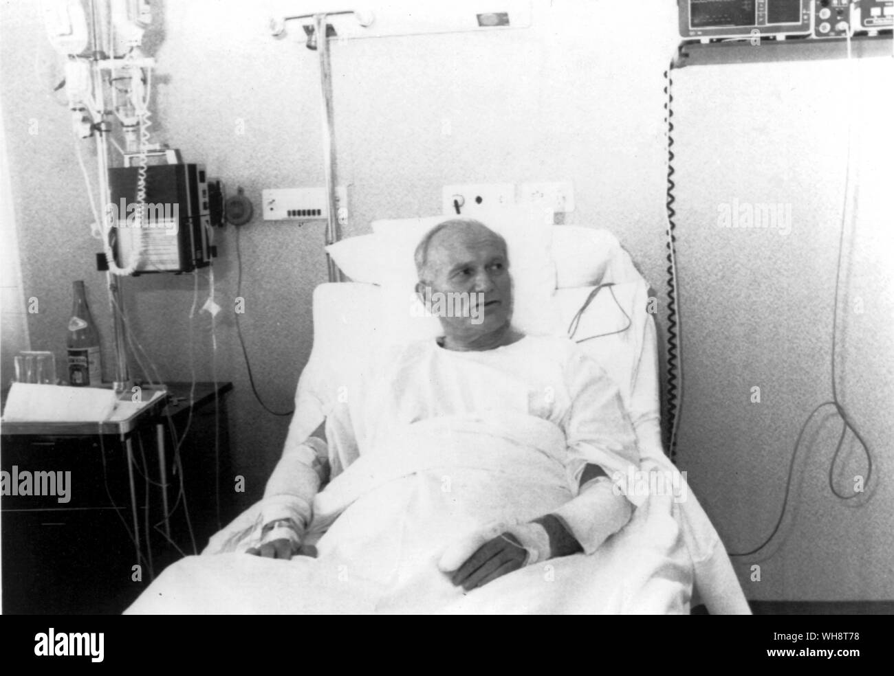 Pope John Paul II sits in hospital bed after an attempt on his life. His right arms and left index finger bandaged May 1981 Stock Photo