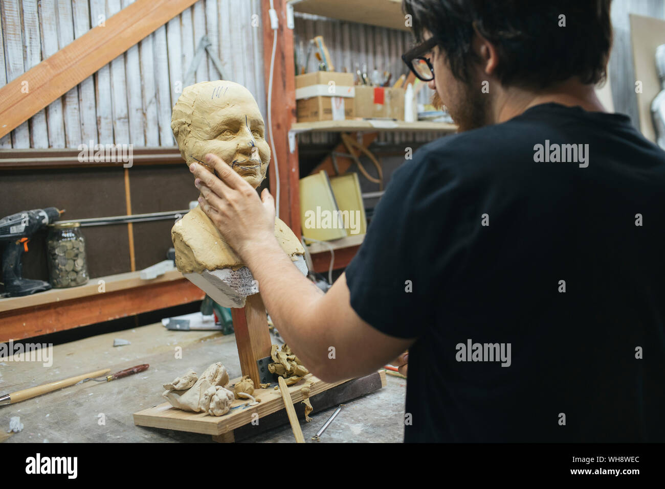 Sculptor working on a bust Stock Photo - Alamy