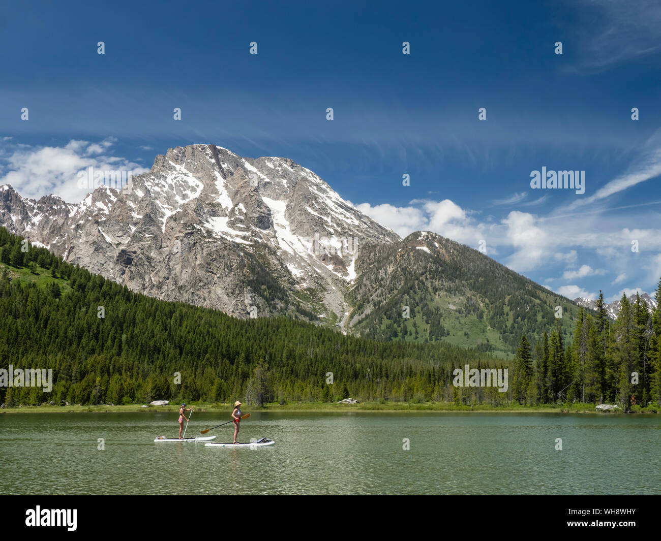 Stand up paddle boarders on String Lake, Grand Teton National Park, Wyoming, United States of America, North America Stock Photo