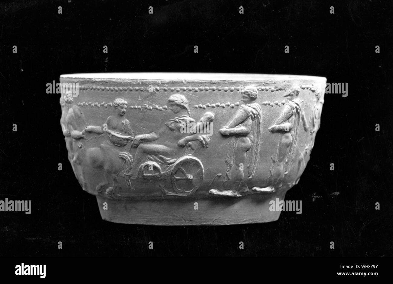 Cast from a pottery mould manufactured at Arretium, Etruria. The subject matter, inspired by the notoriety of Antony and Cleopatra, is Hercules ensnared by Omphale.. Stock Photo