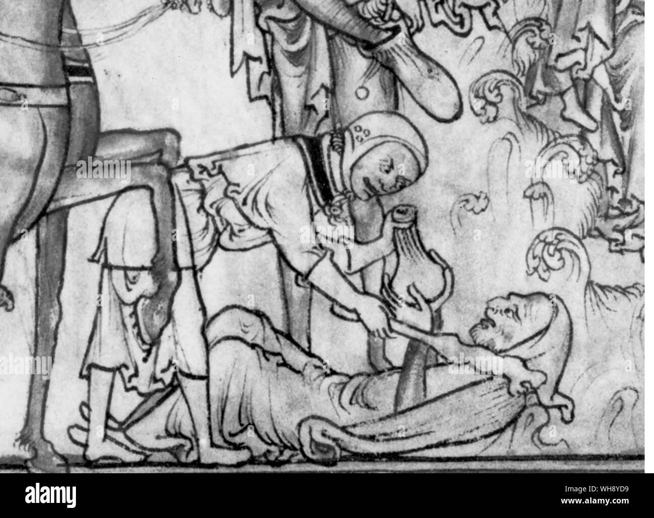 Robbed....at traveller hastily hands over his purse- but perhaps it is the King's money. Stock Photo