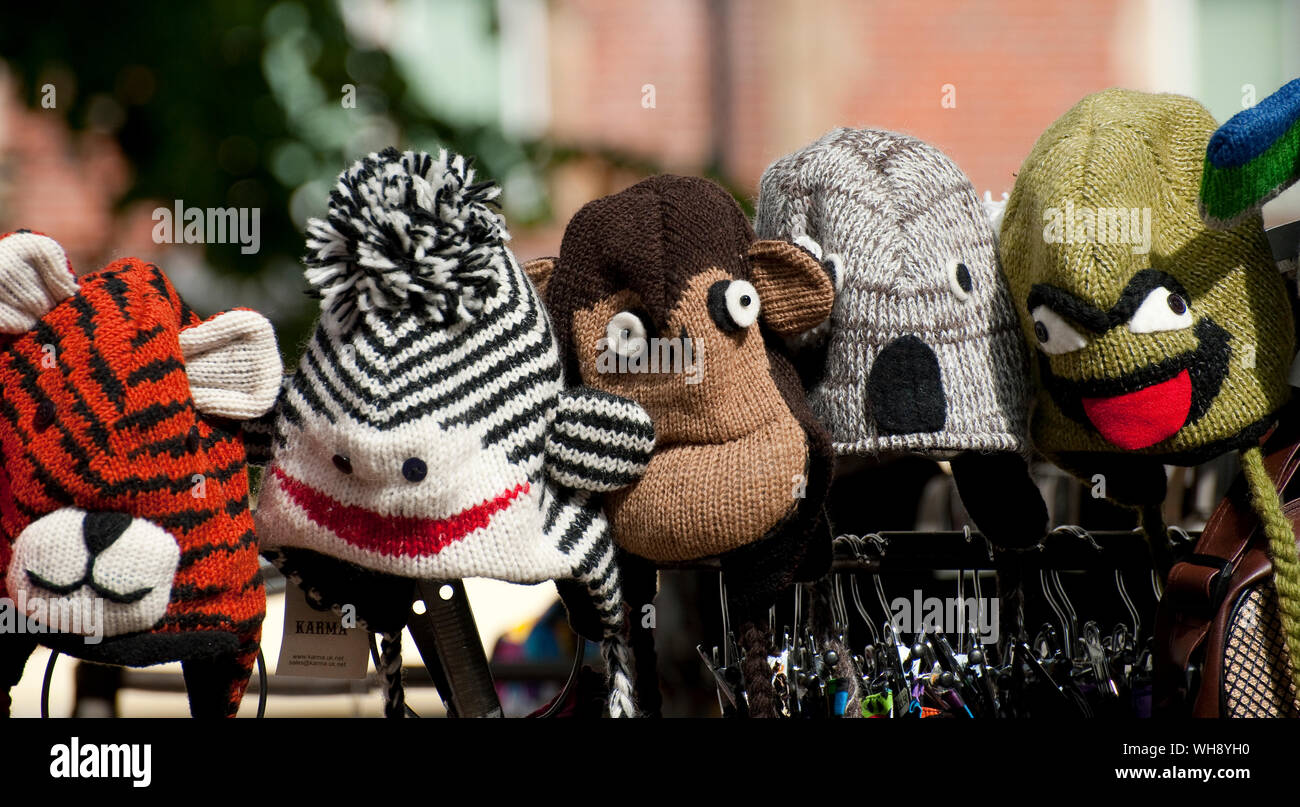 Novelty woolly hats for sale on a market stall Stock Photo Alamy